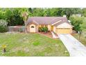 Inviting single-Gathering home with a spacious front yard and beautiful landscaping at 4744 Burlington Rd, Land O Lakes, FL 34639