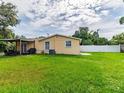 Spacious backyard with a covered patio, perfect for entertaining or relaxing at 6706 S Trask St, Tampa, FL 33616