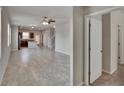 Open-concept living room featuring tile floors and seamless flow into the kitchen at 7325 Parkshore Dr, Apollo Beach, FL 33572