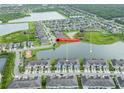 A birds eye view of a beautiful neighborhood near a pond at 9140 Hillcroft Dr, Riverview, FL 33578
