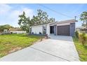 Lovely single-story home boasting manicured landscaping and modern design elements at 9511 N Hyaleah Rd, Tampa, FL 33617