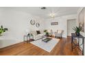 Bright living room with hardwood floors, modern furnishings, and ample natural light at 1419 30Th N Ave, St Petersburg, FL 33704