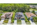 Spacious single-Gathering home with a lush lawn, situated in a peaceful, wooded neighborhood at 1958 Marshberry Ct, Trinity, FL 34655