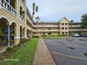 Lovely condo building featuring an inviting exterior and landscaped grounds at 2221 Norwegian Dr # 15, Clearwater, FL 33763