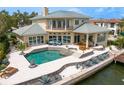Luxury home featuring a beautiful pool, spa, and waterfront access at 2279 Mermaid Ne Pt, St Petersburg, FL 33703