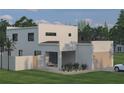 Modern home with an attached garage, minimalist design, and desert-style landscaping in the front at 2560 4Th S Ave, St Petersburg, FL 33712