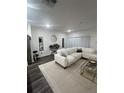 Stylish living room with a sectional sofa, modern decor, and contemporary lighting at 4743 Deer Track St, Tampa, FL 33610