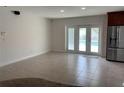 Open-concept living room with recessed lighting and access to the pool area through glass doors at 6474 29Th N Ave, St Petersburg, FL 33710