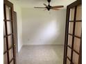 Bright office space featuring a ceiling fan, neutral walls, and beautiful french doors at 6474 29Th N Ave, St Petersburg, FL 33710