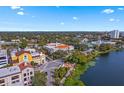Aerial view showcasing the city, lakefront, and historic building, with lush trees at 701 Mirror Lake N Dr # 103, St Petersburg, FL 33701