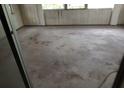 A well-lit room awaits transformation with a large window and spacious layout at 902 Marshall St, Clearwater, FL 33755
