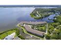 An aerial view of waterfront condos with private docks and amazing water views at 115 Brent Cir, Oldsmar, FL 34677