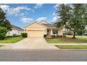 Inviting single-Gathering home with a well-maintained lawn, two-car garage and cozy front porch at 11849 Forest Park Cir, Bradenton, FL 34211