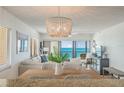 Open-concept living room showcasing modern décor and a gorgeous ocean view at 15000 Gulf Blvd # 901, Madeira Beach, FL 33708