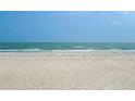 Beautiful beach view with white sand, blue skies, and crystal water at 18610 Gulf Blvd # 208, Indian Shores, FL 33785
