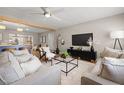 Inviting living room featuring a ceiling fan, an open floor plan, and contemporary decor at 2066 62Nd Pl S 62Nd Pl, St Petersburg, FL 33712
