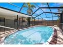 Inviting in-ground pool with clear water and a screened enclosure perfect for outdoor relaxation and entertainment at 2066 62Nd Pi S, St Petersburg, FL 33712