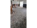 Spacious living room featuring exposed framing and subflooring ready for renovation at 2469 Trade Winds Dr, Dunedin, FL 34698