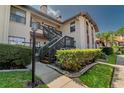 Inviting condo exterior with well-manicured landscaping and charming architectural details at 2640 Enterprise E Rd # B25, Clearwater, FL 33759