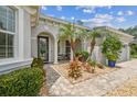 Inviting front entrance with manicured landscaping and decorative stone pathway at 32015 Summerglade Dr, Wesley Chapel, FL 33545