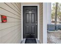 Exterior view of front door with unit number 101 and fire alarm at 3305 Haviland Ct # 101, Palm Harbor, FL 34684