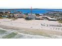 Expansive beach aerial showcasing condo and waterfront with gorgeous ocean view at 4950 Gulf Blvd # 404, St Pete Beach, FL 33706