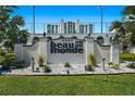Elegant Beau Monde signage amidst manicured landscaping and lush greenery at 4950 Gulf Blvd # 404, St Pete Beach, FL 33706
