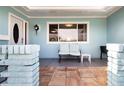 Covered front porch with seating area perfect for enjoying the outdoors at 624 La Jolla Ave, Sun City Center, FL 33573