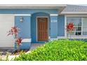 Close-up of the home's inviting front entrance, showcasing the door's design and the house number at 6324 35Th Avenue E Cir, Palmetto, FL 34221