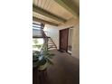 Condo entryway with unit number, stairway, and space for plants at 8602 Huron Court # 47, Tampa, FL 33614
