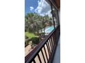 Enjoy a lovely view of the pool and grounds from your screened porch at 8602 Huron Court # 47, Tampa, FL 33614