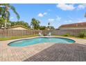 Private pool with brick pavers, perfect for relaxation and entertainment in a serene backyard setting at 9309 120Th St, Seminole, FL 33772