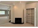 Bright living room featuring a fireplace and built-in shelving at 12206 N 53Rd St, Temple Terrace, FL 33617