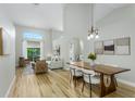 Bright and airy living room with hardwood floors, high ceilings, and an open floor plan at 12335 Glenfield Ave, Tampa, FL 33626