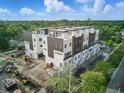 Modern townhome showcases sleek architectural design, multiple stories and contemporary finishes in a green neighborhood at 2120 4Th S St, St Petersburg, FL 33705