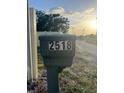House address on a green marker by the roadside at 2518 Mabry St, Tampa, FL 33618