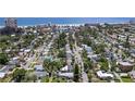 Excellent aerial view of the house nestled in a peaceful neighborhood with a glimpse of the ocean at 257 43Rd Ave, St Pete Beach, FL 33706