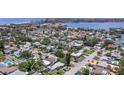 Scenic aerial view showcases the property in a charming neighborhood near a picturesque lake at 257 43Rd Ave, St Pete Beach, FL 33706