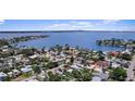 Stunning aerial view displaying the property situated near a serene lake and lush surroundings at 257 43Rd Ave, St Pete Beach, FL 33706