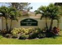 Entrance to Countrygrove East featuring lush landscaping and signage at 2784 Alexander Dr, Clearwater, FL 33763