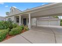 Exterior view of home with landscaped front yard and spacious carport with three-car garage at 4306 Barracuda Dr, Bradenton, FL 34208