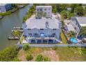 Waterfront home with a spiral staircase, patio, and boat dock at 601 2Nd St, Indian Rocks Beach, FL 33785
