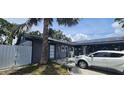 Home's exterior showing solar panels, gray paint, and landscaped yard at 7515 Brookhaven Ct, Tampa, FL 33634