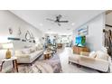 Open-concept living room boasts neutral decor, tile floors, and seamlessly connects to the kitchen at 7849 52Nd E Ter, Bradenton, FL 34203