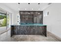 Modern kitchen with a large island, sleek countertops, stainless steel appliances, and ample natural light at 805 Paris S Ave, St Petersburg, FL 33701