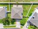 Overhead view of the house showing the roof, backyard, and surrounding neighborhood at 8806 Bayaud Dr, Tampa, FL 33626