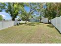 Spacious fenced backyard offering ample room for recreation and privacy at 1207 Oak Valley Dr, Seffner, FL 33584