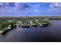 Beautiful waterfront community with homes lining the lake shore at 15012 Maurine Cove Ln, Odessa, FL 33556