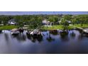Waterfront home with private dock, boat lift, and lush backyard at 15012 Maurine Cove Ln, Odessa, FL 33556