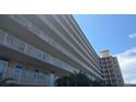A view of the exterior of the condominium building showcasing multiple levels and balcony railings at 1847 Shore Drive S # 415, South Pasadena, FL 33707